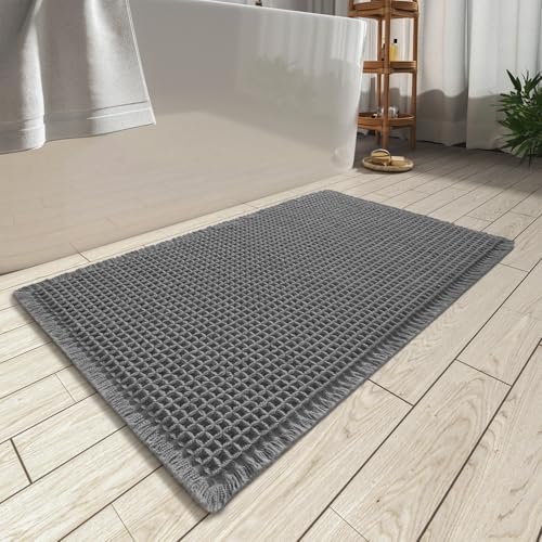AMOAMI Upgraded Waffle Bath Mat, Super Absorbent Non Slip Bath Mats for Bathroom Floor, Machine Washable Bathroom Rugs with Tassels, Rubber Backed Bathroom Mats, Ultra Soft, 20" x 32", Dark Grey