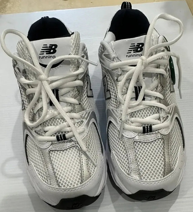 Size 7.5 - New Balance color White silver sneaker